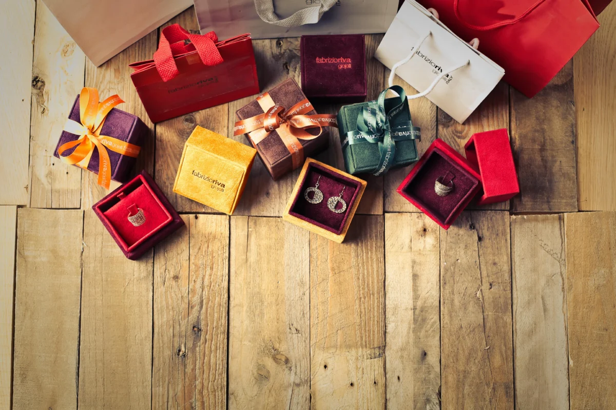 Colorful jewelry gift boxes arranged with luxury shopping bags